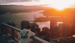 Preview wallpaper city, sunset, loneliness, man, solitude