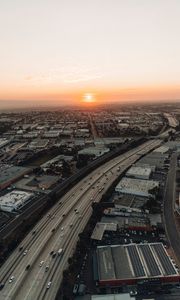 Preview wallpaper city, sunset, roads, buildings, evening