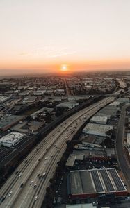 Preview wallpaper city, sunset, roads, buildings, evening