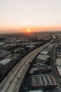 Preview wallpaper city, sunset, roads, buildings, evening