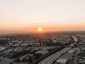 Preview wallpaper city, sunset, roads, buildings, evening