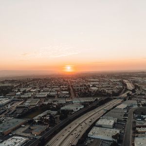 Preview wallpaper city, sunset, roads, buildings, evening