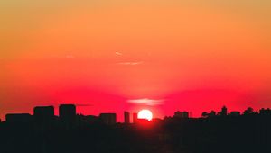 Preview wallpaper city, sunset, sky, horizon, sun
