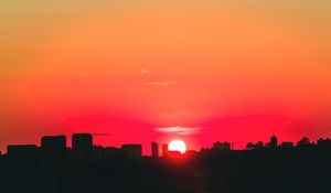 Preview wallpaper city, sunset, sky, horizon, sun