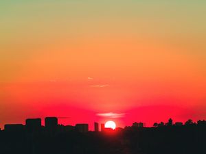 Preview wallpaper city, sunset, sky, horizon, sun
