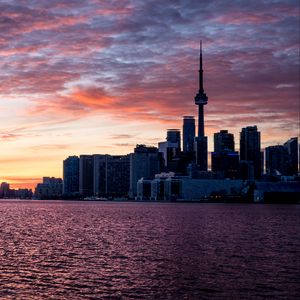 Preview wallpaper city, sunset, sky, water