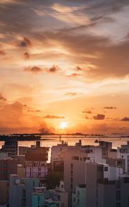 Preview wallpaper city, sunset, sun, evening