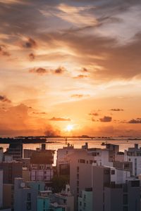 Preview wallpaper city, sunset, sun, evening