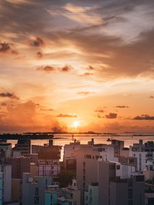 Preview wallpaper city, sunset, sun, evening