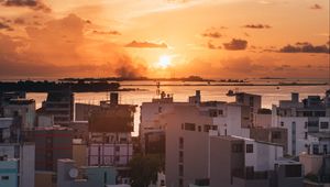 Preview wallpaper city, sunset, sun, evening