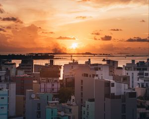 Preview wallpaper city, sunset, sun, evening