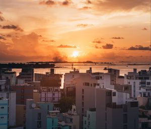 Preview wallpaper city, sunset, sun, evening