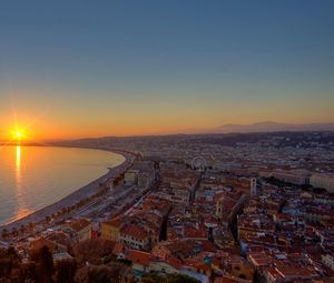 Preview wallpaper city, top view, sunset, sea, buildings