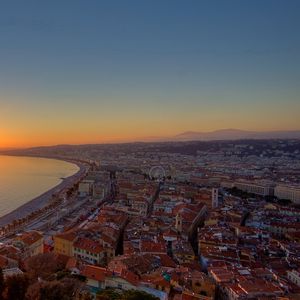 Preview wallpaper city, top view, sunset, sea, buildings