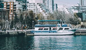 Preview wallpaper city, tower, buildings, boat, pier, water