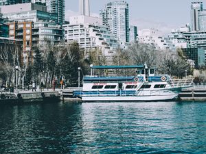 Preview wallpaper city, tower, buildings, boat, pier, water