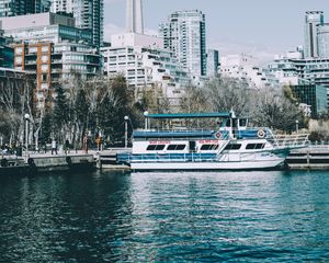 Preview wallpaper city, tower, buildings, boat, pier, water