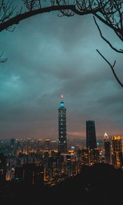 Preview wallpaper city, tower, cityscape, evening, lights, thunderclouds