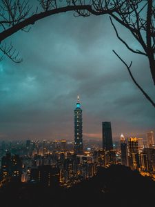 Preview wallpaper city, tower, cityscape, evening, lights, thunderclouds