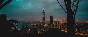 Preview wallpaper city, tower, cityscape, evening, lights, thunderclouds