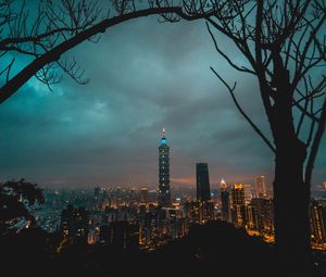 Preview wallpaper city, tower, cityscape, evening, lights, thunderclouds