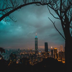 Preview wallpaper city, tower, cityscape, evening, lights, thunderclouds