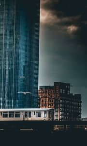 Preview wallpaper city, train, buildings, architecture, dark