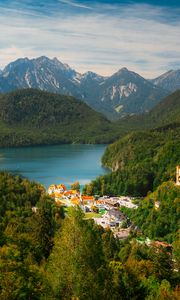 Preview wallpaper city, trees, forest, lake, mountains, clouds, sky, landscape