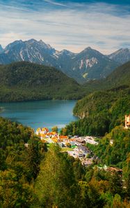 Preview wallpaper city, trees, forest, lake, mountains, clouds, sky, landscape