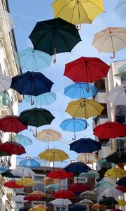 Preview wallpaper city, umbrellas, colorful, sky, flying