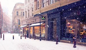 Preview wallpaper city, winter, europe, street, snow, shopping