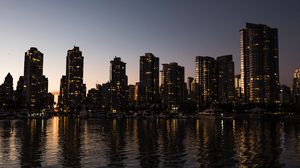 Preview wallpaper cityscape, river, sky, skyscrapers, reflection, evening, vancouver, canada