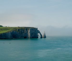 Preview wallpaper cliff, arch, sea, coast, fog, nature