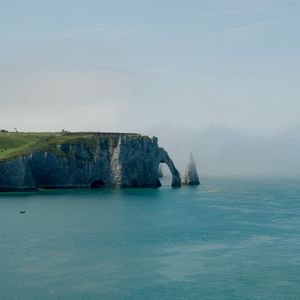 Preview wallpaper cliff, arch, sea, coast, fog, nature