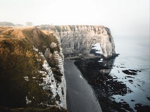 Preview wallpaper cliff, coast, beach, rocks, sea