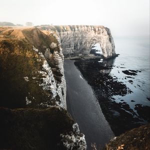 Preview wallpaper cliff, coast, beach, rocks, sea