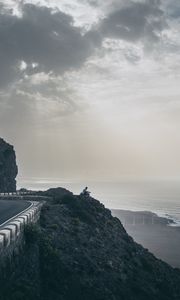 Preview wallpaper cliff, coast, silhouette, sea, road