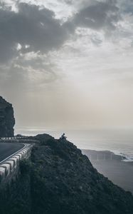 Preview wallpaper cliff, coast, silhouette, sea, road