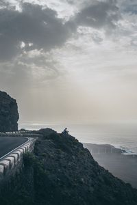 Preview wallpaper cliff, coast, silhouette, sea, road