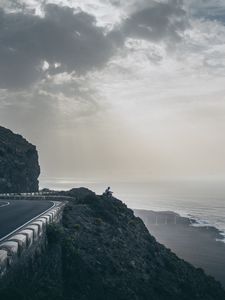 Preview wallpaper cliff, coast, silhouette, sea, road
