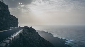 Preview wallpaper cliff, coast, silhouette, sea, road