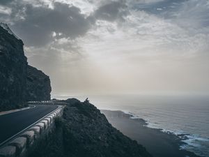 Preview wallpaper cliff, coast, silhouette, sea, road