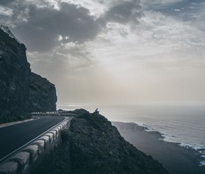 Preview wallpaper cliff, coast, silhouette, sea, road