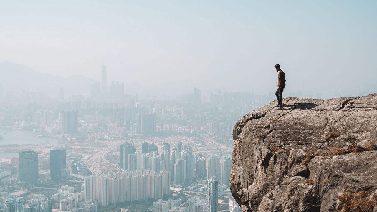 Wallpaper cliff, man, city, aerial view, height, loneliness