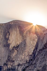 Preview wallpaper cliff, mountain, light, sky