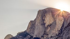 Preview wallpaper cliff, mountain, light, sky