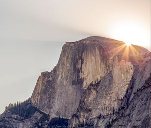 Preview wallpaper cliff, mountain, light, sky