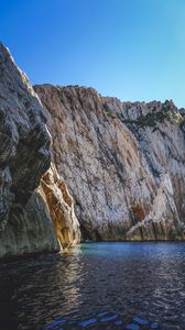 Preview wallpaper cliff, mountains, rocks, lake, sky