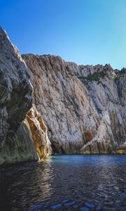 Preview wallpaper cliff, mountains, rocks, lake, sky