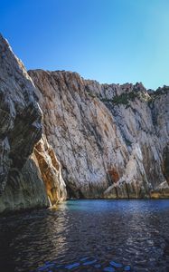 Preview wallpaper cliff, mountains, rocks, lake, sky